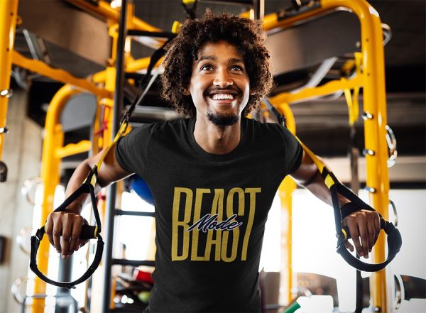 Man wearing beast mode t-shirt at the gym working out