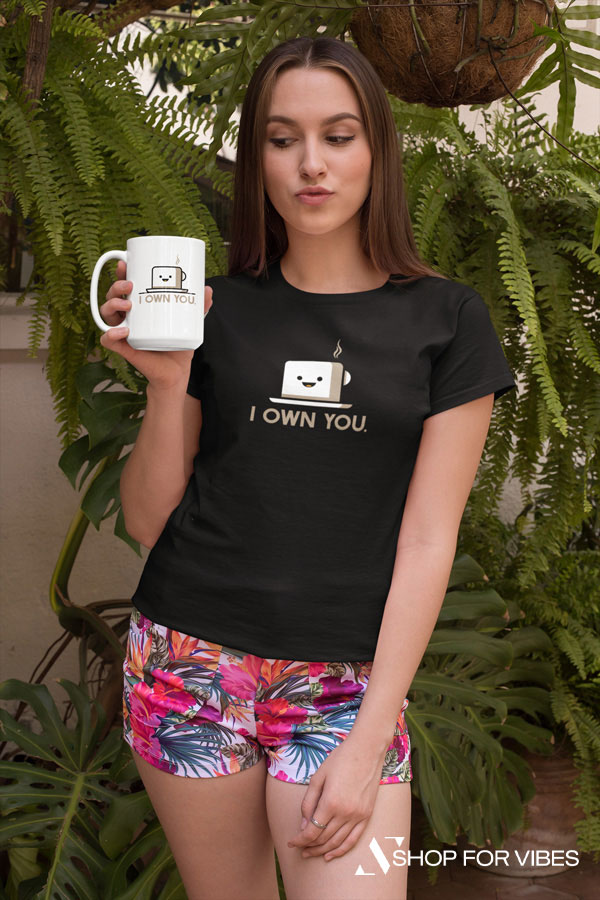 young girl wearing I own you coffee mug and tshirt